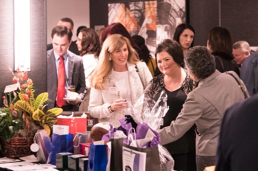 People looking at raffle items